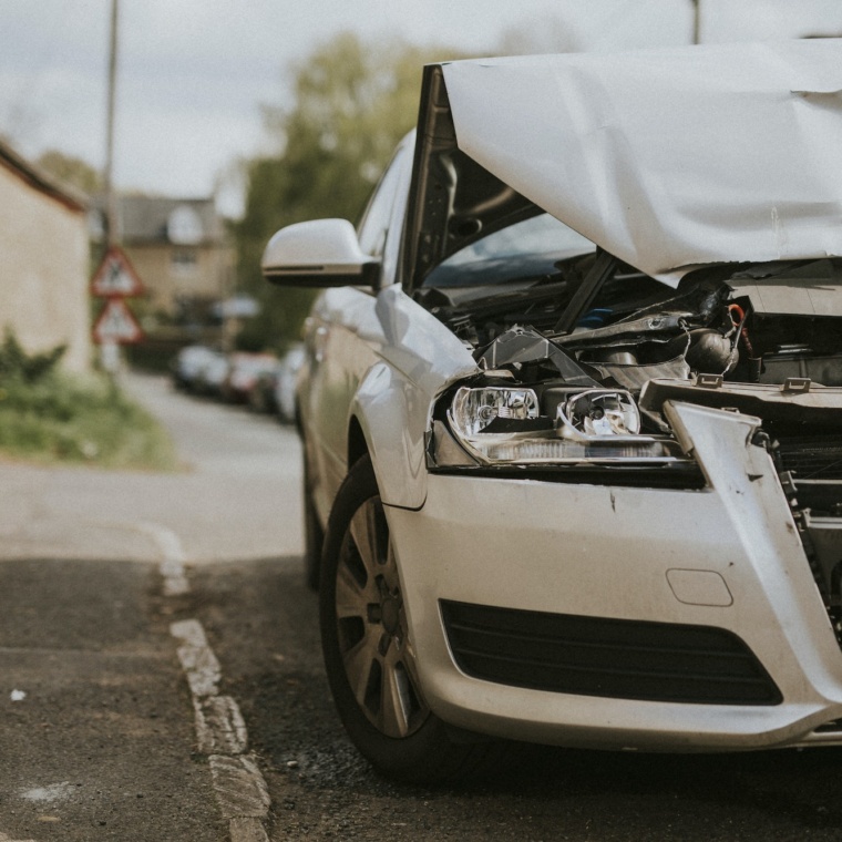 Wrecked car parked on the street after a car crash